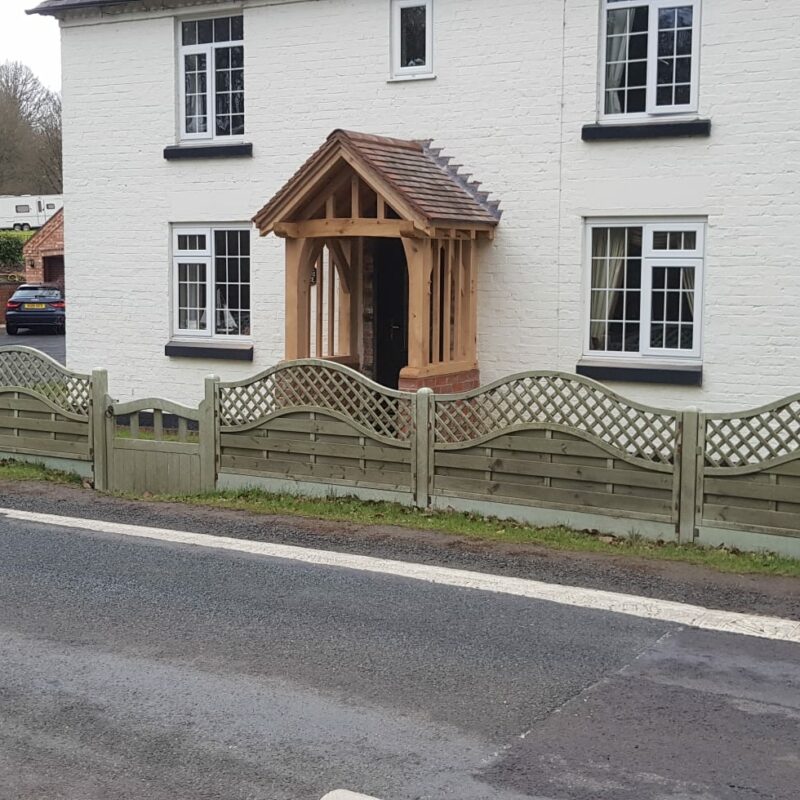 Handcrafted half wall oak framed porch